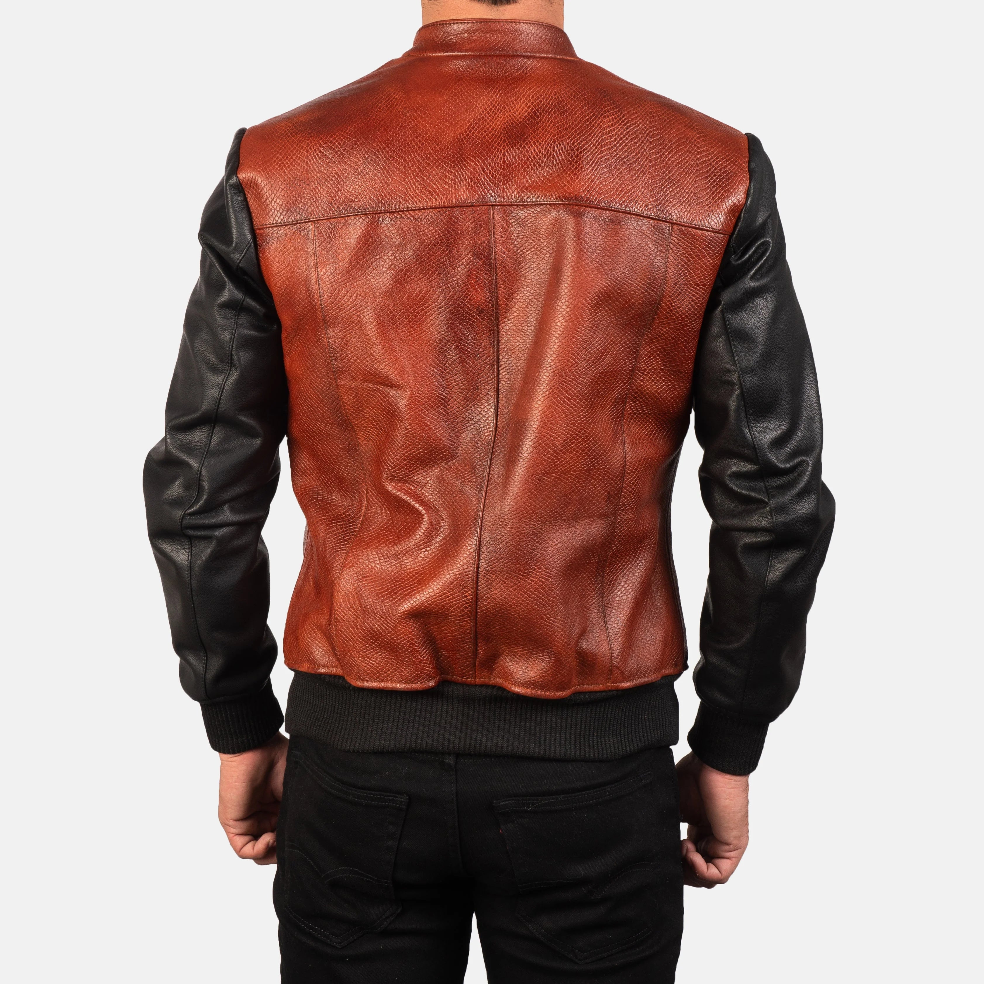 Black and maroon leather bomber. Two-tone, embossed texture, snap collar, ribbed hem.