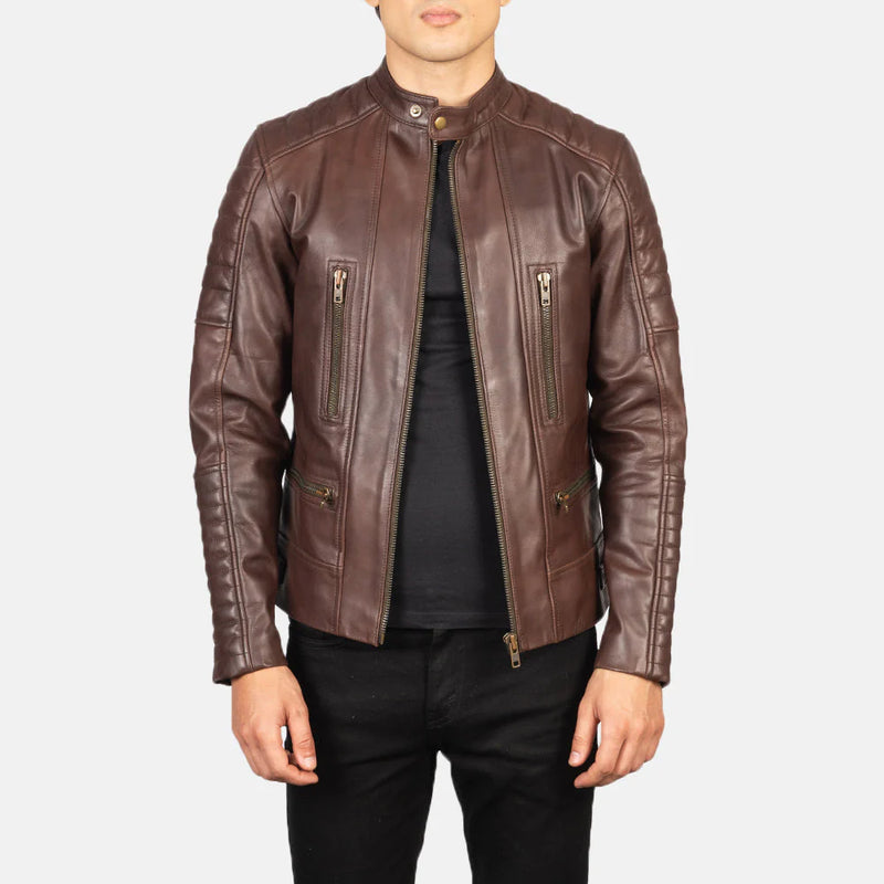 Front view of a man modeling an open distressed brown leather jacket, showing the asymmetrical zip, wide lapel, and quilted shoulder panels.