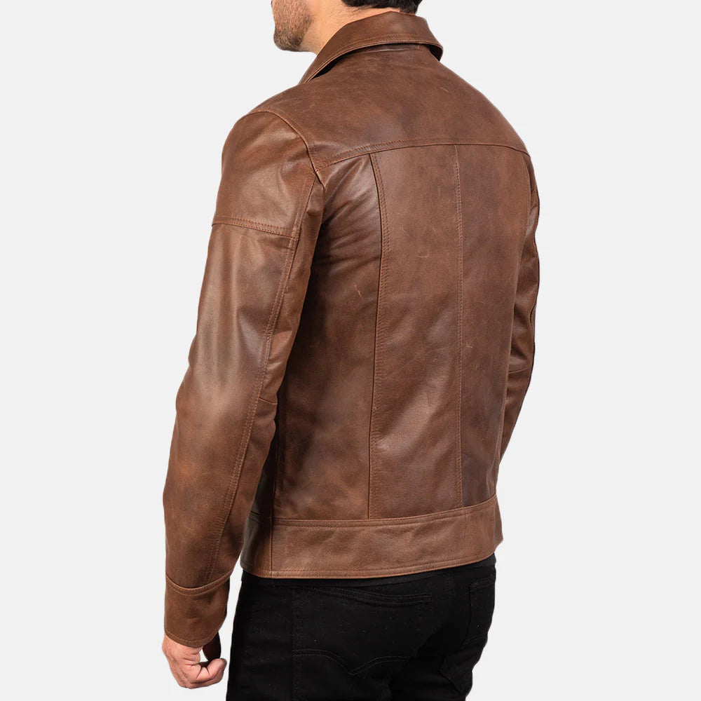 Brown leather jacket. Point collar, full zip, moto style, sleek.