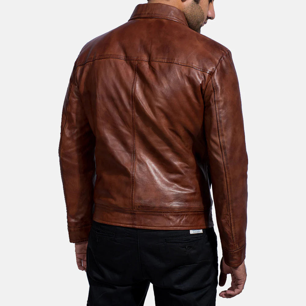 Smooth rich brown leather jacket featuring a classic point collar and clean front zipper closure.