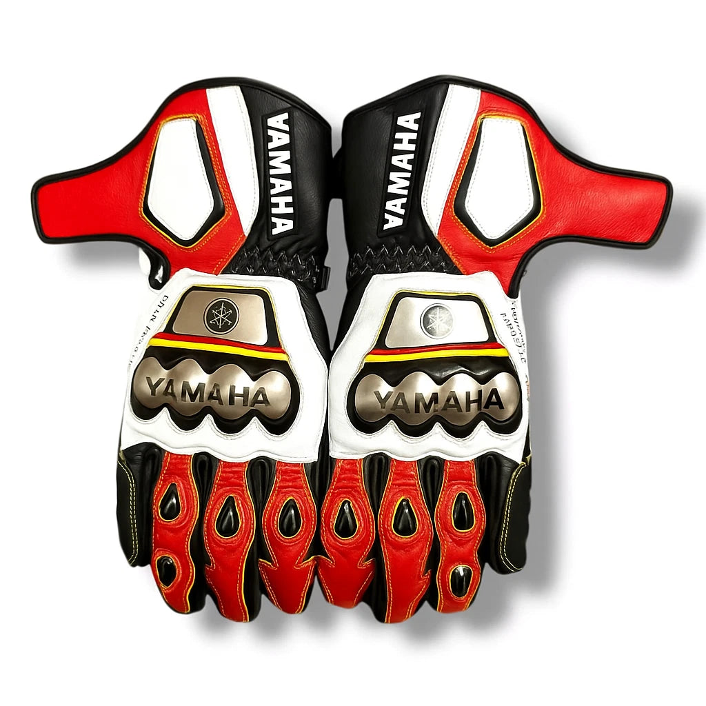 Yamaha leather motorcycle racing gloves in white, red, and black with metallic knuckle armor.