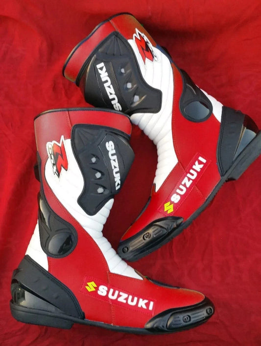 Suzuki GSX tricolor leather motorcycle racing boots in red, white, and black with shin armor."