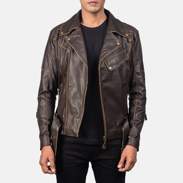 Front view of a brown leather double rider jacket, showing the asymmetrical zip, buckled straps, and light-colored contrast stitching.