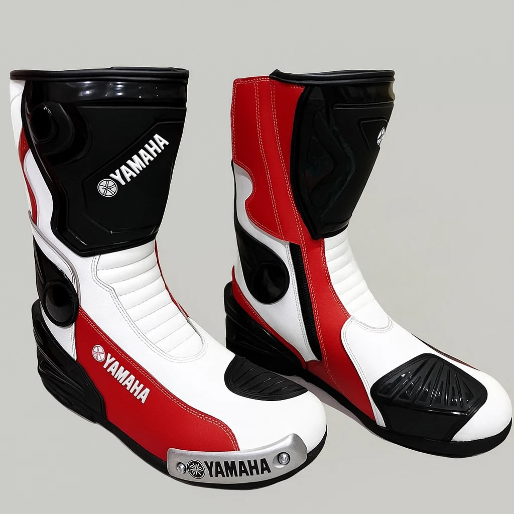 Yamaha Racing tricolor leather motorcycle racing boots in red, white, and black with metallic toe sliders.