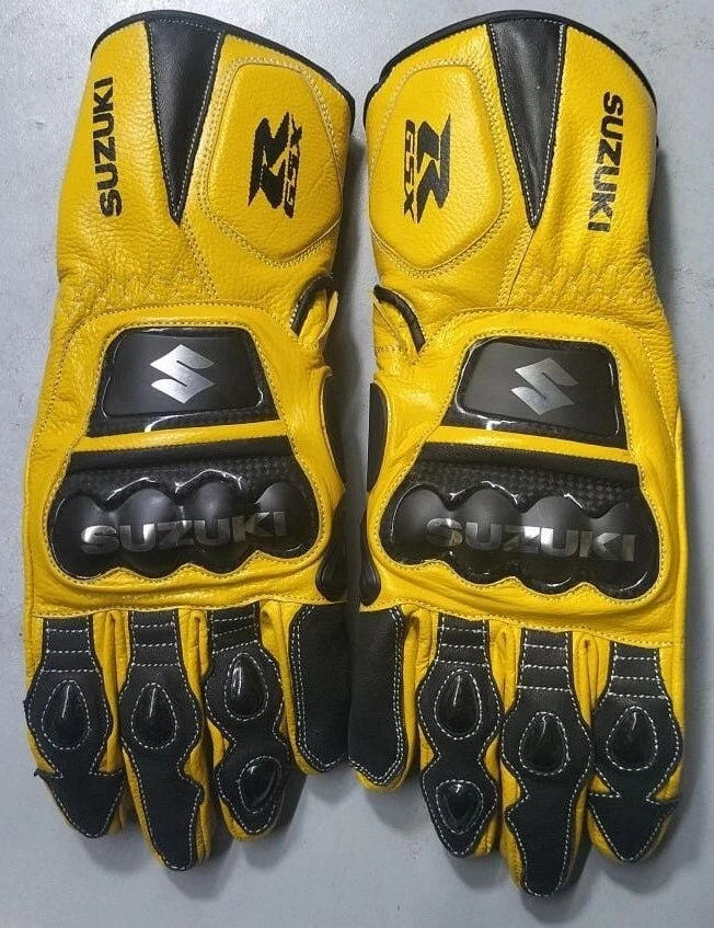 Suzuki GSX-R racing leather motorcycle gloves in yellow and black with metallic knuckle armor.