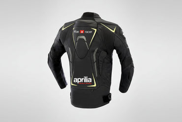 Detailed view of the Aprilia Racing chest logo and high-visibility yellow technical accents on a professional leather racing jacket.