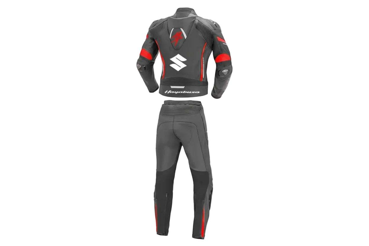 Detailed view of the red Hayabusa chest logo and Suzuki forearm branding on a professional leather track suit.