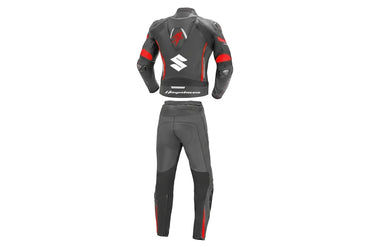 Detailed view of the red Hayabusa chest logo and Suzuki forearm branding on a professional leather track suit.