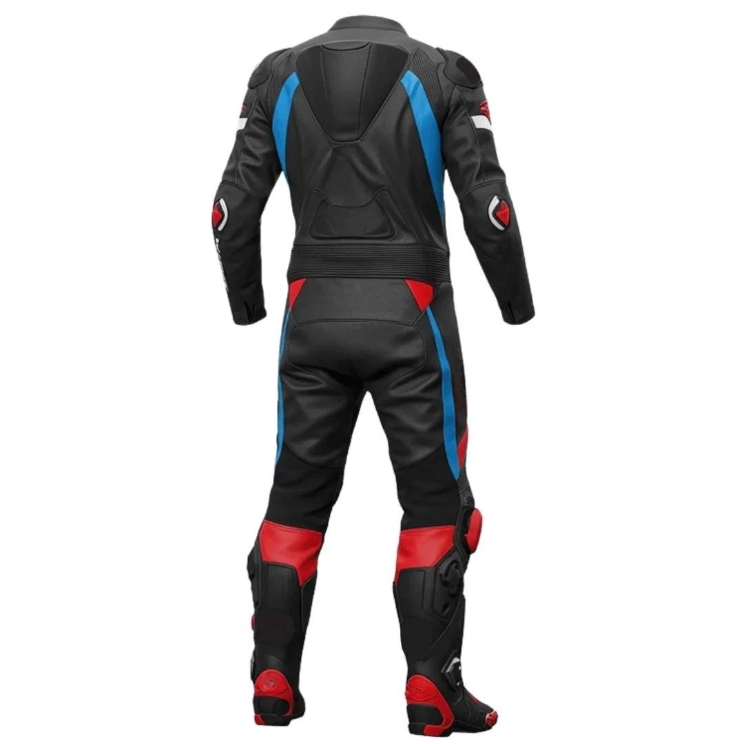 Detailed view of the Suzuki blue chest logo, blue high-visibility panels, and black knee sliders on a track suit.