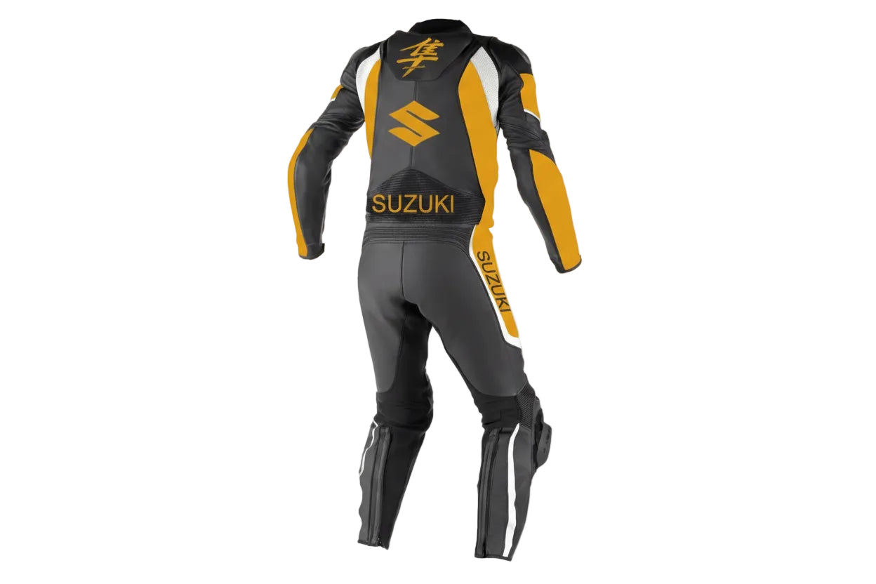 Detailed view of the golden Hayabusa kanji chest logo and Suzuki forearm branding on a professional leather track suit.