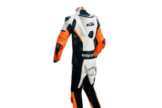 Professional track suit featuring an aerodynamic KTM livery with integrated safety armor and stretch panels.
