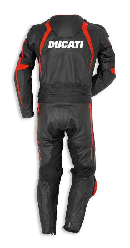 Detailed view of the Ducati Corse chest shield, red technical outlines, and professional red knee sliders on a black leather track suit.