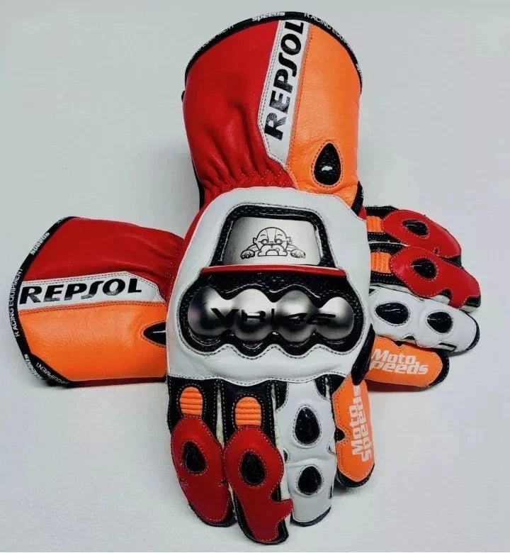 Repsol leather motorcycle racing gloves in orange, red, and white with metallic knuckle armor.