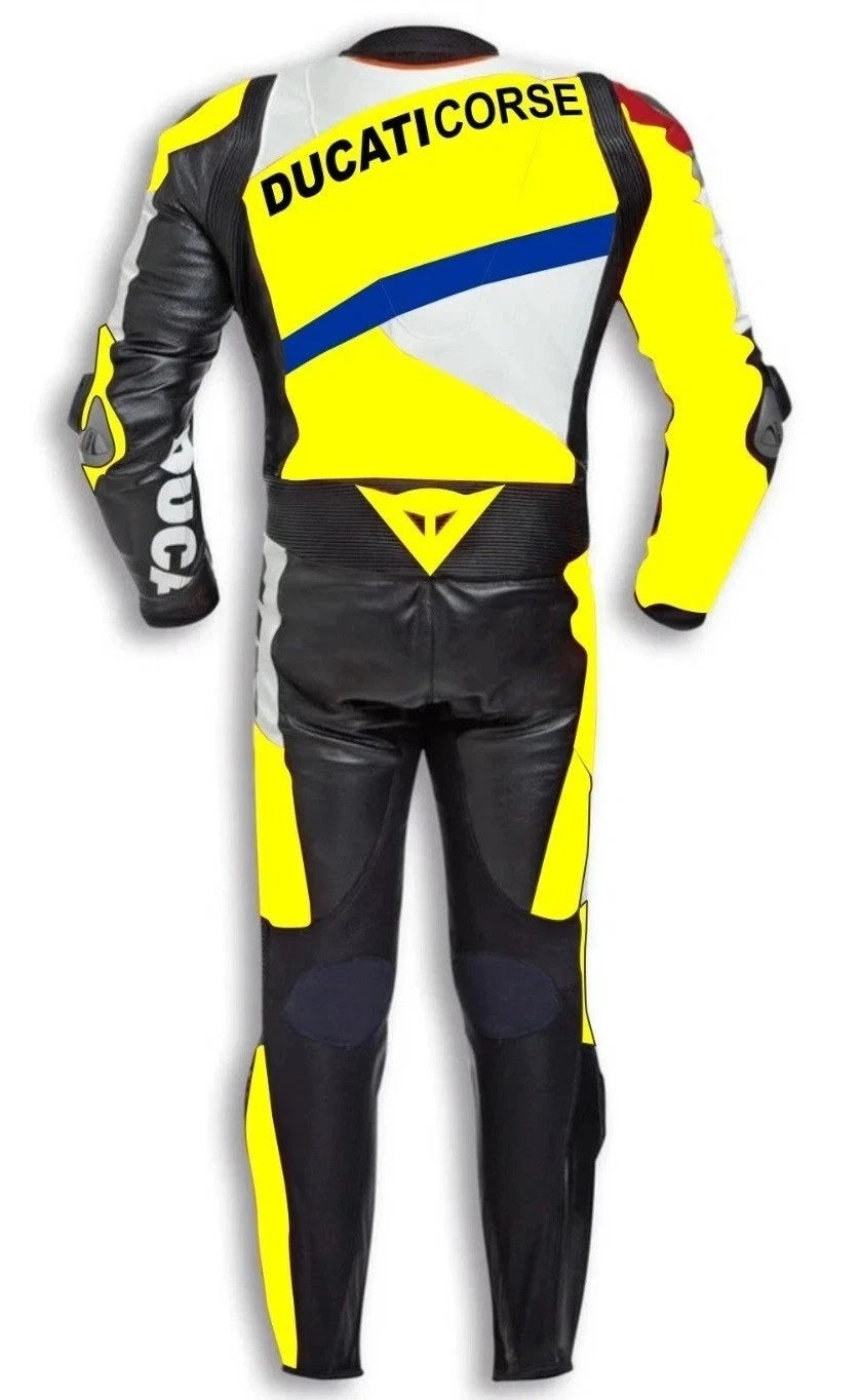 Detailed view of the DUCATICORSE chest wordmark, metallic shoulder sliders, and vibrant yellow panels on a professional leather suit.