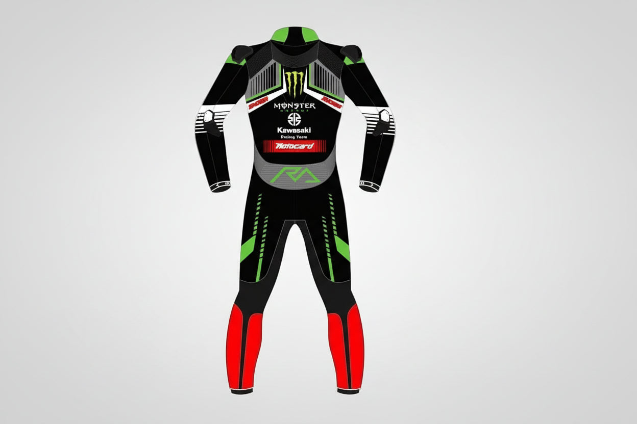 Detailed view of the Monster Energy claw logo, Kawasaki Racing Team chest branding, and red racing leg panels on a professional suit.