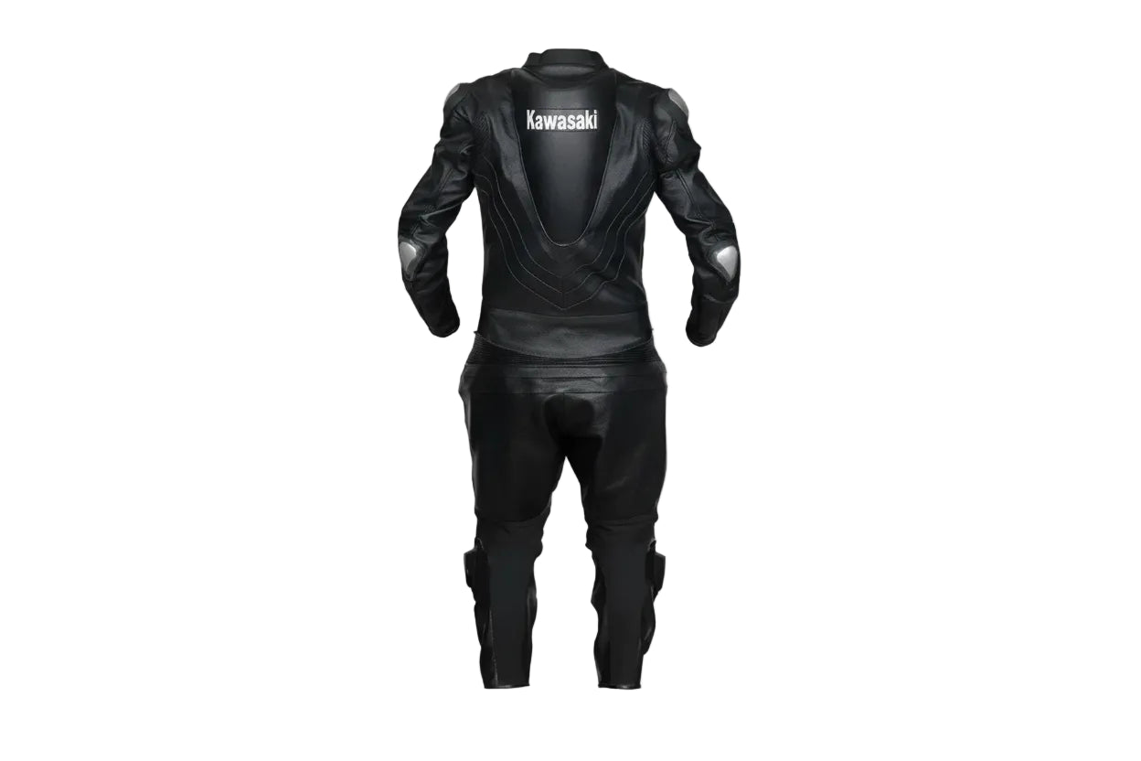 Detailed view of the white Kawasaki chest branding and high-performance accordion stretch panels on a black leather track suit.