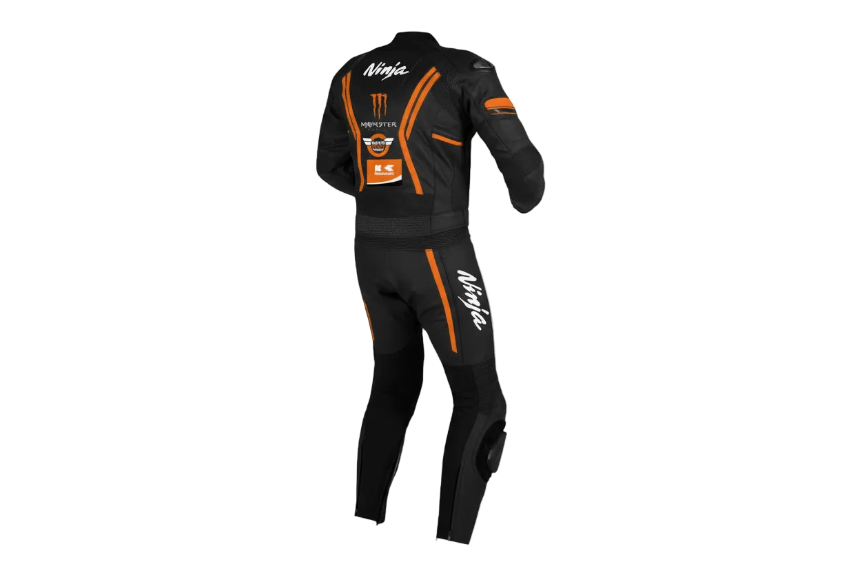 Detailed view of the orange Monster Energy claw logo and Kawasaki Ninja graphics on a professional black leather track suit.