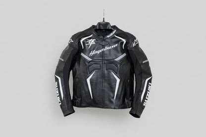 Suzuki Hayabusa black and white leather motorcycle racing jacket with Kanji logo and integrated armor.