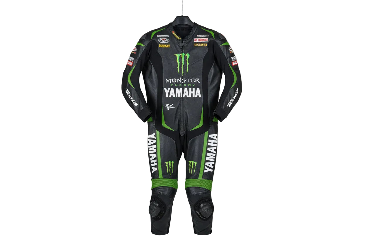 Yamaha Tech3 Monster Energy black and green leather motorcycle racing suit with professional sponsor patches and integrated armor.