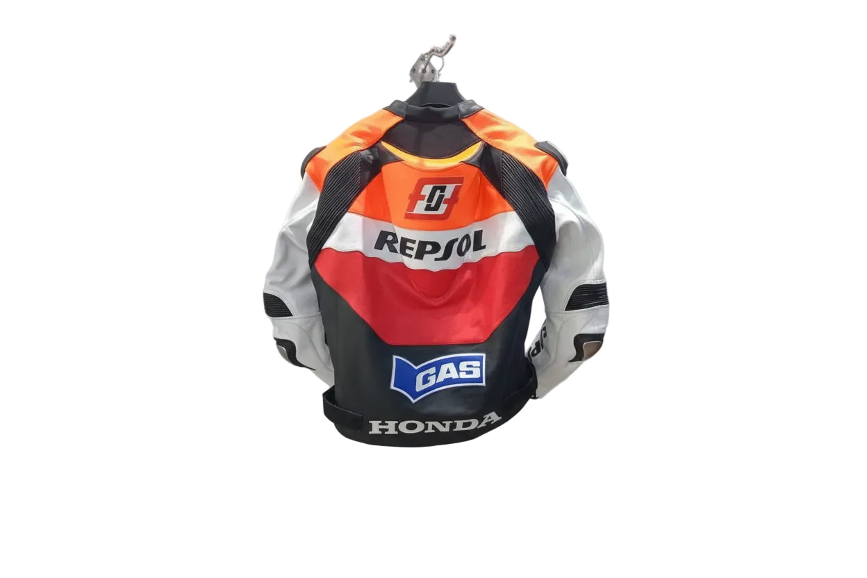 Detailed view of the Repsol chest logo, sponsor patches, and external shoulder sliders on a professional Honda racing jacket.