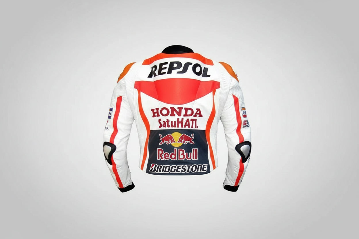 Detailed view of the Repsol chest logo, Red Bull sponsor patches, and external hard-shell shoulder sliders on a professional leather jacket.