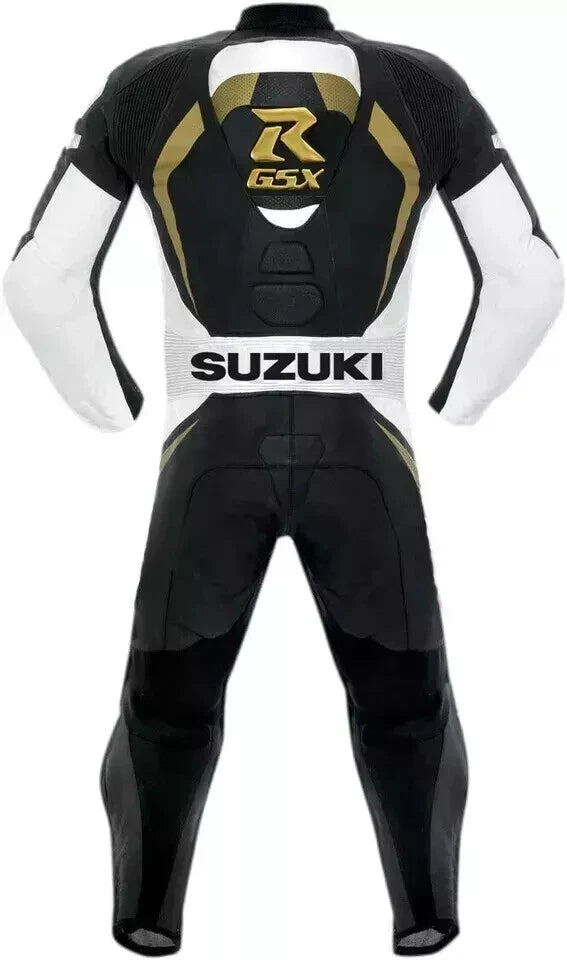 Detailed view of the gold Suzuki GSX-R logo, white leather paneling, and professional knee sliders on a one-piece racing suit.