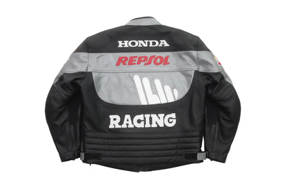 Detailed view of the red Repsol chest logo, white Racing graphics, and slate grey leather panels on a professional Honda jacket.