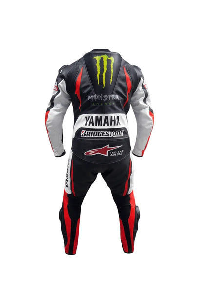 Detailed view of the Yamaha chest logo, perforated leather panels, and tricolor shoulder graphics on a professional racing suit.