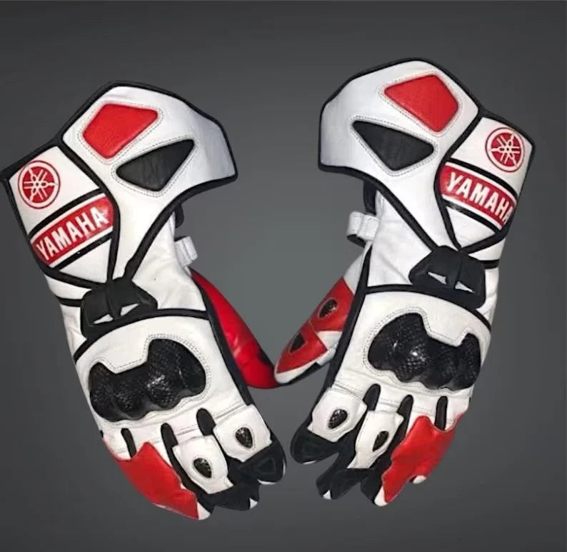 Yamaha factory leather motorcycle racing gloves in black and red with metallic knuckle armor.