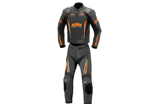 KTM Racing black and orange leather motorcycle racing suit with 'Ready to Race' branding and integrated armor.