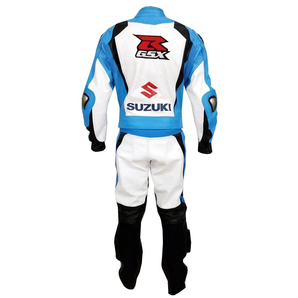 Detailed view of the Suzuki chest logo, royal blue aerodynamic panels, and black knee sliders on a track-certified racing suit.