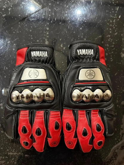Yamaha factory leather motorcycle racing gloves in black and red with metallic knuckle armor.