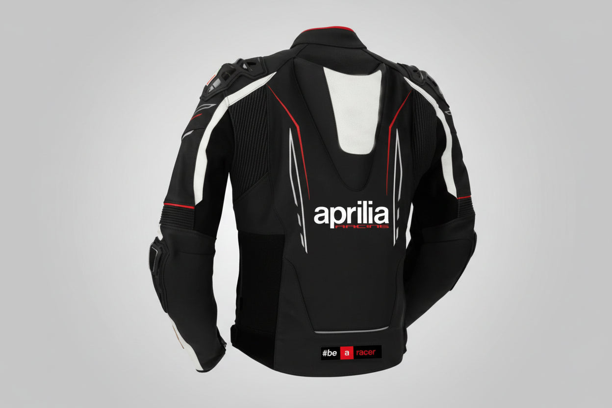 Detailed view of the Aprilia Racing chest branding, Akrapovič logo, and accordion stretch panels on a professional racing jacket.