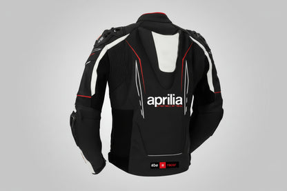 Detailed view of the Aprilia Racing chest branding, Akrapovič logo, and accordion stretch panels on a professional racing jacket.